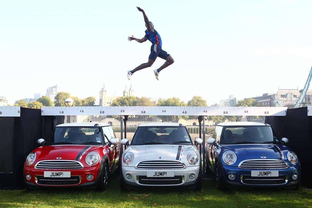 Athlete over achieving by jumping over Minis